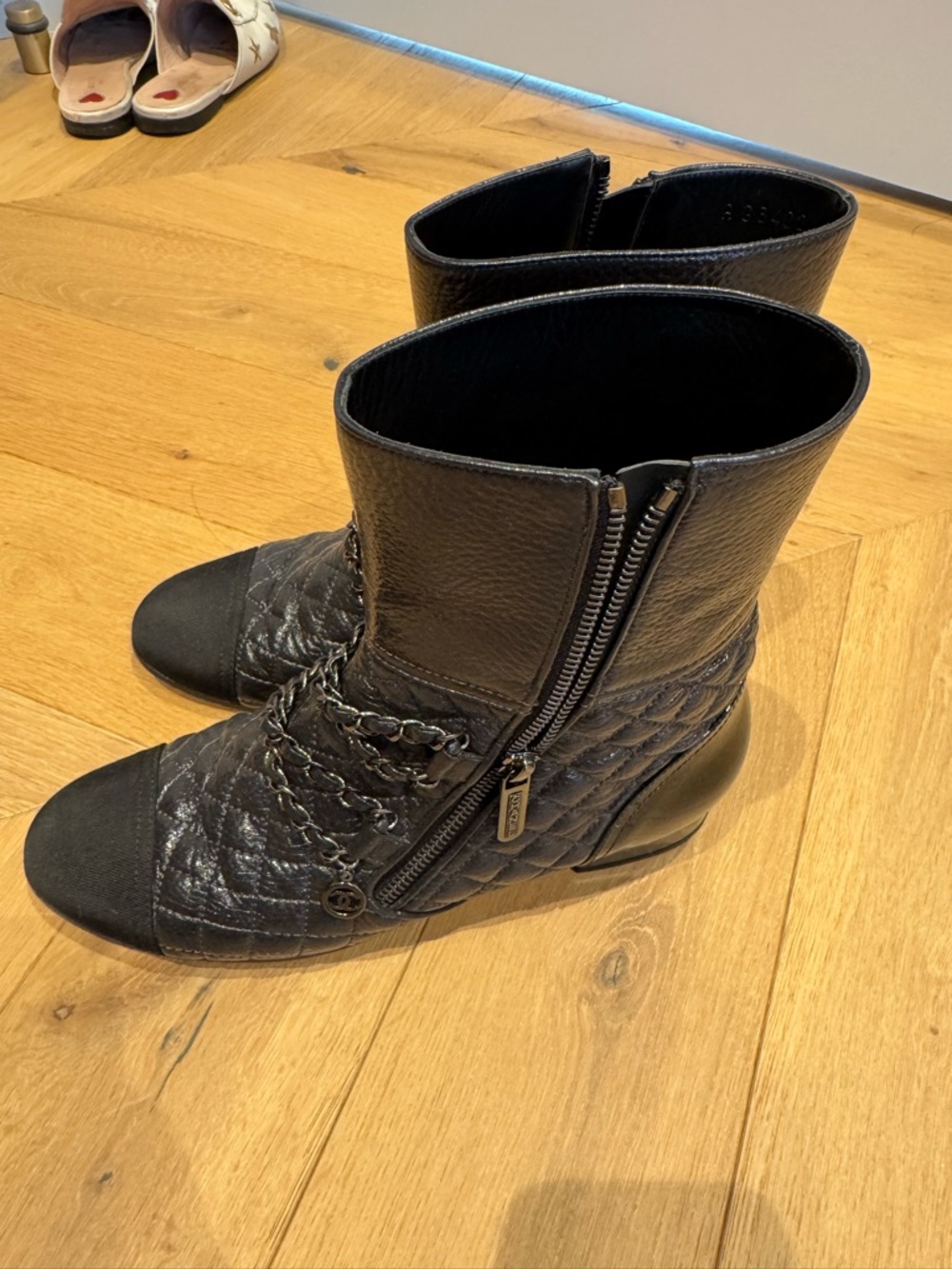 CHANEL Black Quilted Leather Ankle Boots with Chain Trim